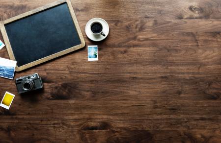 Photography of Tray, Coffee Cup and Camera on Table Top