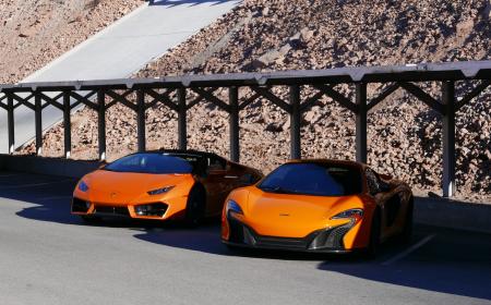 Photography of Two Orange Sports Car