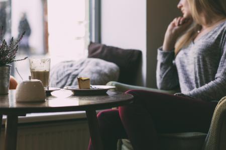 Photography of Woman Near Round Table during Daytime