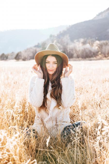 Photography of Woman on Brown Field