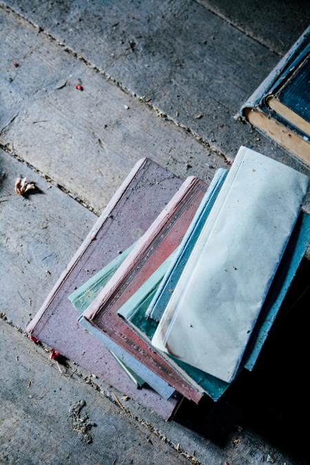 Pile of Books on Brown Wooden Surface during Daytime