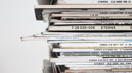 Piled Vinyl Records With White Background