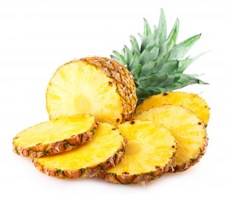 Pineapple with slices isolated on white