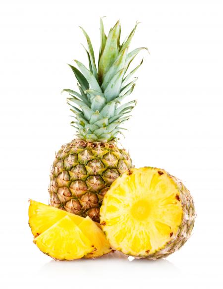 Pineapple with slices isolated on white