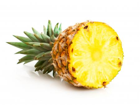 Pineapple with slices isolated on white