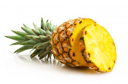 Pineapple with slices isolated on white