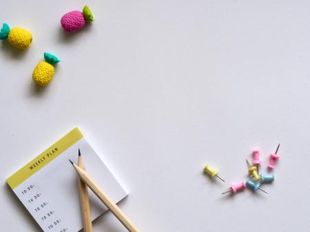 Pink, Yellow, and Blue Push Pins and Brown Pencil