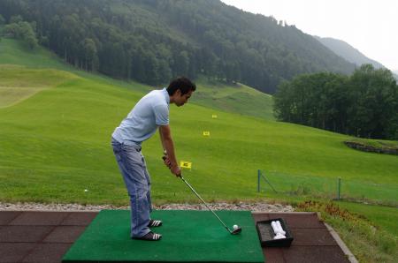 Player practicing golf