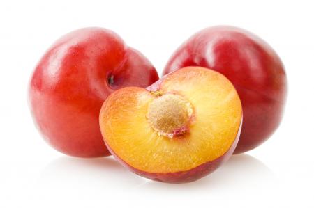 Plums isolated on white background