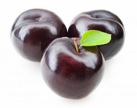 Plums isolated on white background