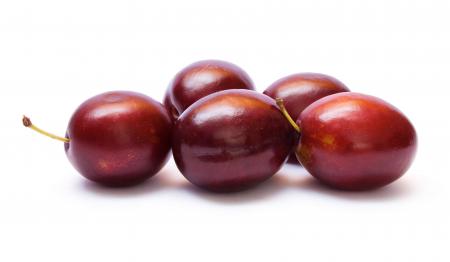 Plums isolated on white background