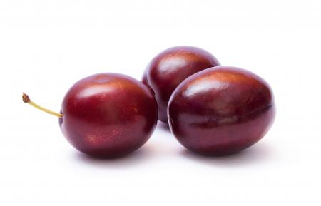 Plums isolated on white background