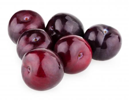 Plums isolated on white background