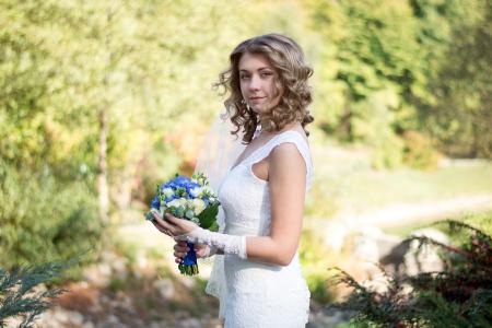 Portrait of a Beautiful Woman Holding Flower