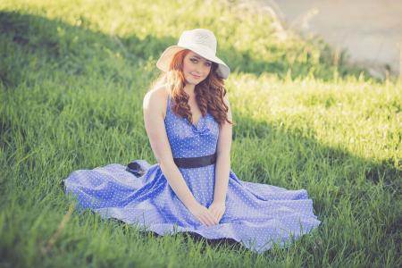 Portrait of a Smiling Young Woman in Grass