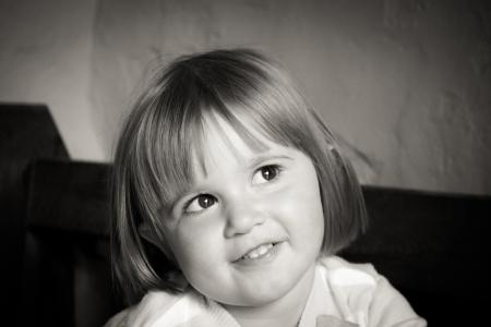 Portrait of Smiling Girl With Short Hair in Grayscale Photography