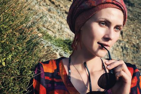 Portrait of Woman Holding Black Sunglasses