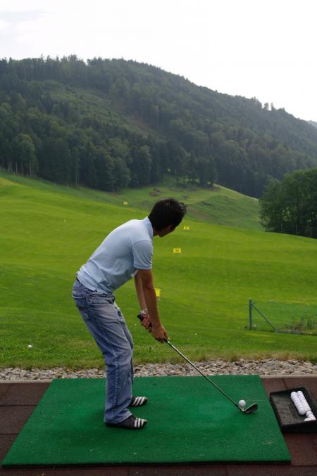 Practicing golf