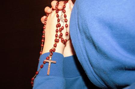 Praying Holding String of Beads