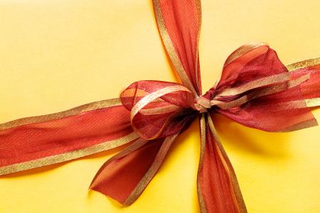 Present box with red bow