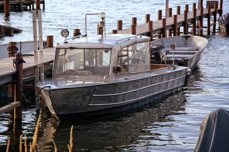 Product Photography of Silver Motor Boat Neck Dock during Daytime