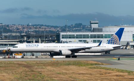 Profile view of United Airlines B757-300 (N77865) on tarmac at SFO