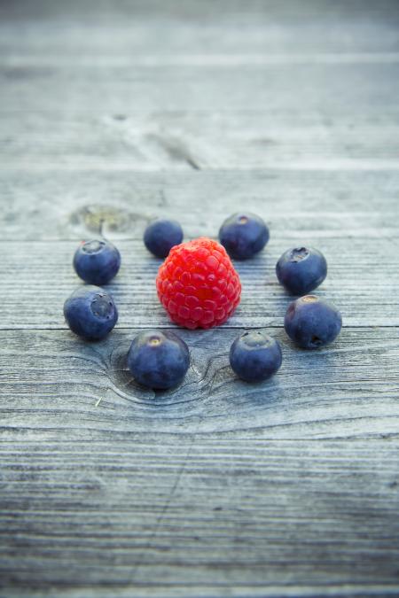 Raspberry Beside Blueberries