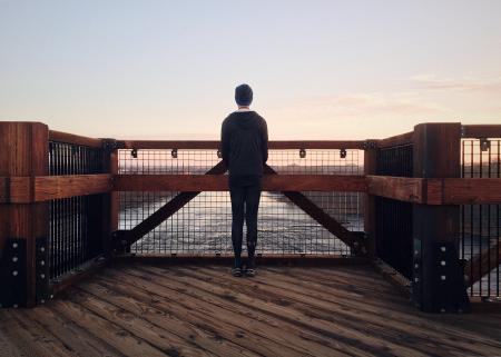 Rear View of a Man Walking on Beach