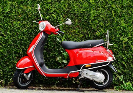 Red and Black Moped Scooter Beside Green Grass