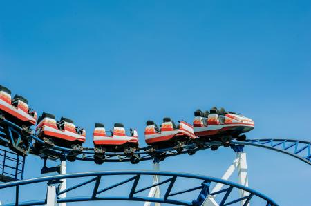 Red and White Roller Coaster on Railings