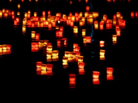 Red and Yellow Paper Lantern on Body of Water