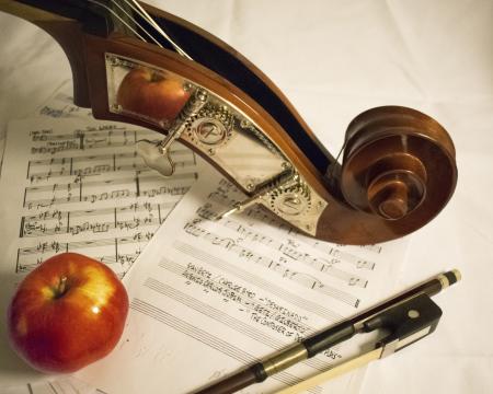 Red Apple Fruit on Music Sheet