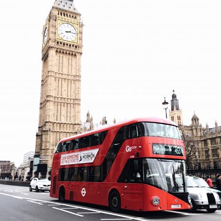 Red Bus on Road Near Big Ben in London