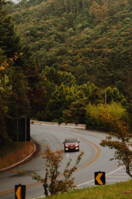 Red Car Travels on the Curved Road