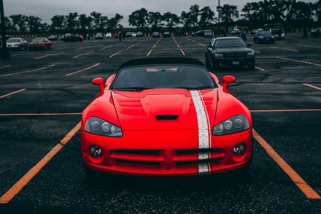 Red Convertible Coupe on Black Surface