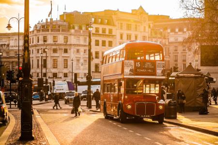 Red Double Decker Bus on Street Near People