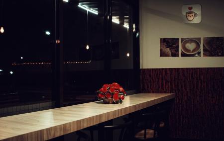 Red Rose Arrangement Decor on Brown Wooden Desk