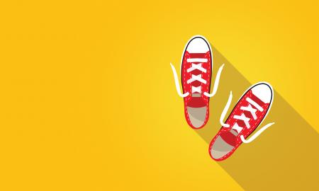 Red Sneakers on Bright Yellow Background