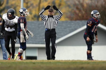 Referee Between 3 Football Player