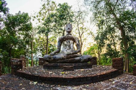 Religious Statue Surrounded by Green Trees