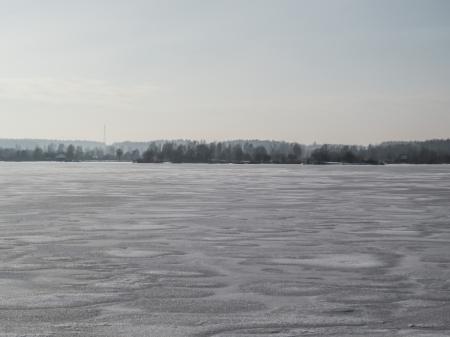 River covered with a thick layer of ice