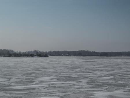 River covered with a thick layer of ice