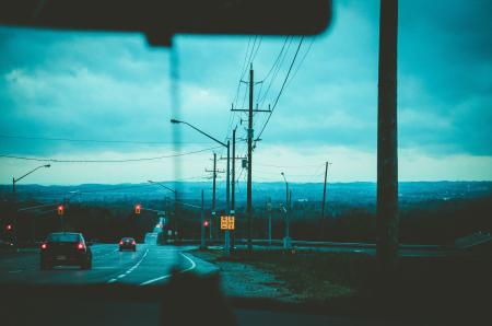 Road With Light Posts from Inside Car's Point of View