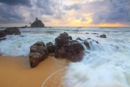 Rock on Beach Shore With Waves Crashing during Cloudy Daytime Sky