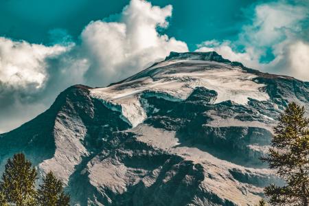 Rocky Mountain Under Blue Cloudy Sky