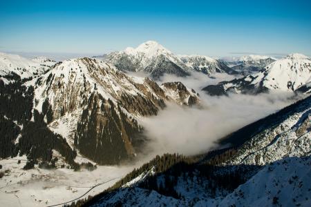 Rocky Mountain With Fog in Daytime Photo