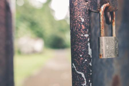 Rusted Grey Padlock in Selective-focus Photography