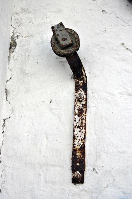 Rusted metal bar and wheel