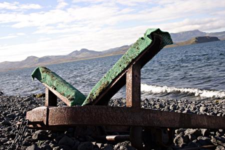 Rusted metal rail by the lake