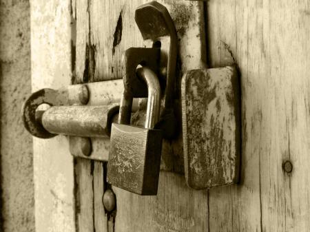 Rusty padlock covered with hoarfrost ice crystals